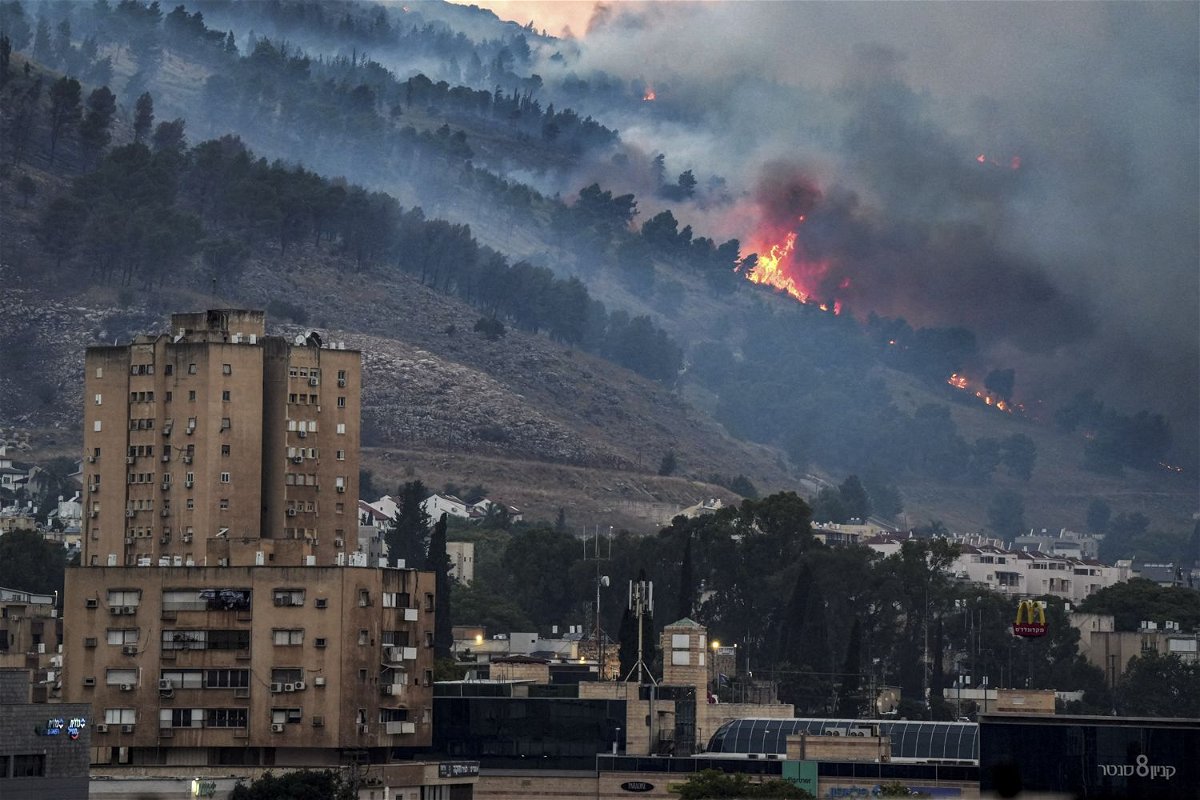 <i>Ayal Margolin/Reuters via CNN Newsource</i><br/>Smoke and fire are seen ﻿near Kiryat Shmona