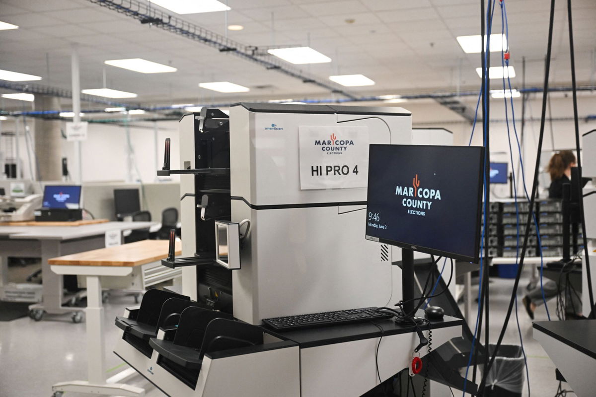 <i>Patrick T. Fallon/AFP/Getty Images via CNN Newsource</i><br/>Machines for counting early ballot stand secured in the tabulation room at the Maricopa County Tabulation and Election Center in Phoenix on June 3.