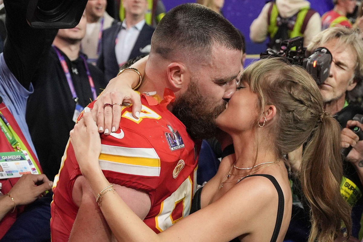 <i>John Locher/AP via CNN Newsource</i><br/>Travis Kelce kisses Taylor Swift on the field at Arrowhead Stadium after the Kansas City Chiefs beat the San Fransisco 49ers in the 2024 Super Bowl.