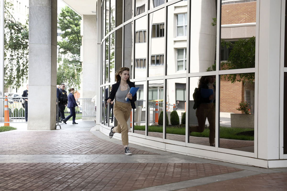 <i>Anna Moneymaker/Getty Images via CNN Newsource</i><br/>CNN runner Macayla Cook runs to deliver the news about the verdict in Hunter Biden's trial on June 11