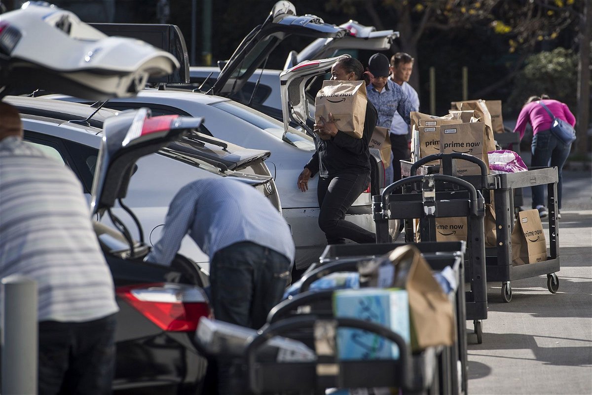 <i>David Paul Morris/Bloomberg/Getty Images/File via CNN Newsource</i><br/>Contractors working for the Amazon Inc. Flex program load packages into vehicles to deliver to customers in San Francisco