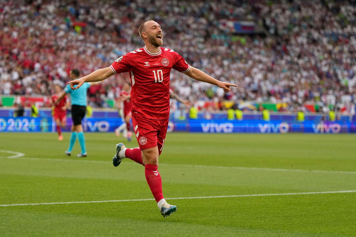 <i>Matthias Schrader/AP via CNN Newsource</i><br/>Christian Eriksen celebrates after scoring Denmark's opening goal against Slovenia.