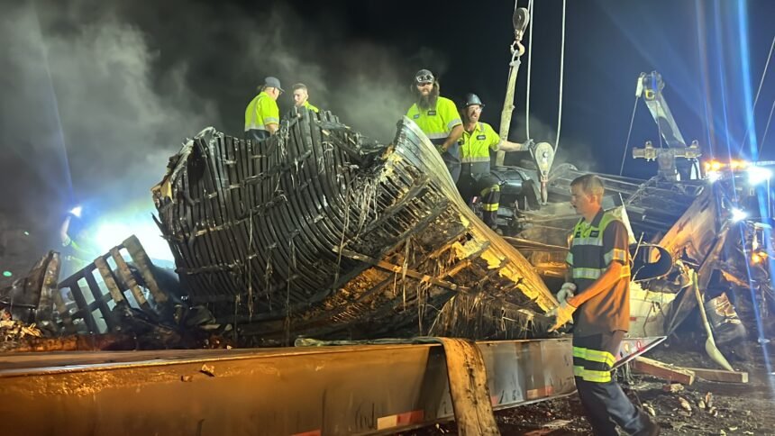 Crews clean up burnt semi trailer