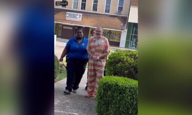 Greg Lawson is escorted to the Claiborne Parish Courthouse Monday.