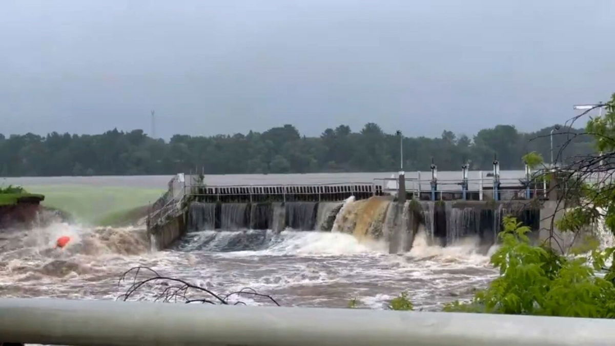 <i>Noah Cornelius/WGBA via CNN Newsource</i><br/>Water rushes from Manawa Dam in Wisconsin on Friday.