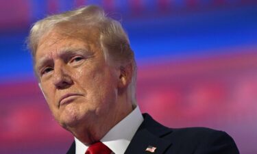 Former US President and 2024 Republican presidential candidate Donald Trump stands on stage after accepting his party's nomination on the last day of the 2024 Republican National Convention at the Fiserv Forum in Milwaukee