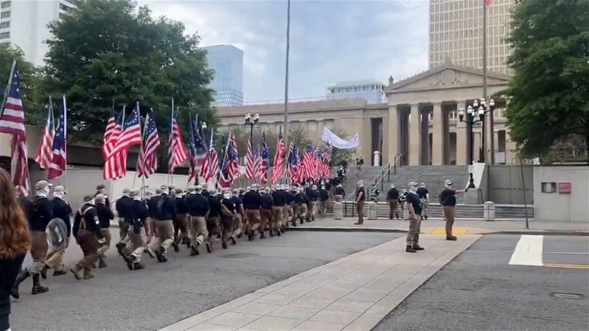 <i>@headspacehouse via CNN Newsource</i><br/>Protesters believed to be affiliated with the White supremacist group Patriot Front march near the Tennessee House of Representatives and the Tennessee State Capitol.