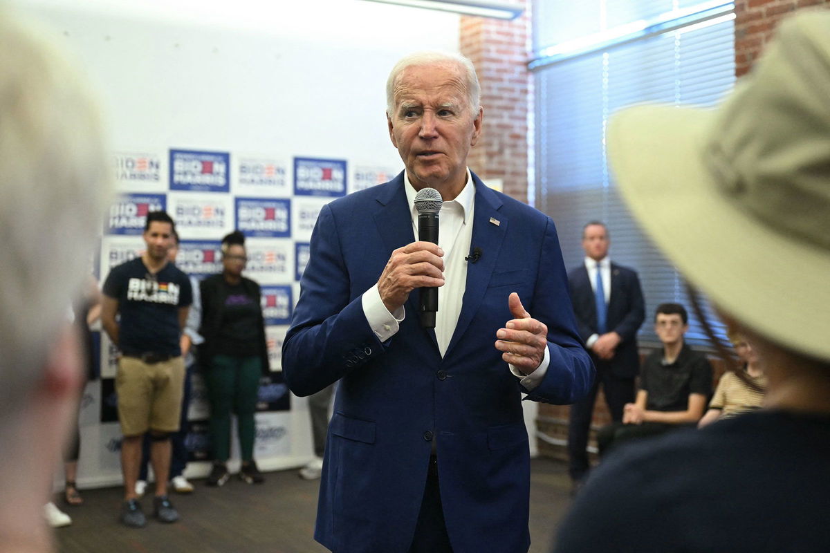 <i>Saul Loeb/AFP/Getty Images via CNN Newsource</i><br/>President Joe Biden speaks to supporters and volunteers during a visit to a campaign office in Philadelphia on July 7