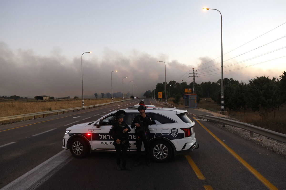 <i>Jalaa Marey/AFP/Getty Images via CNN Newsource</i><br/>Israeli police secure a road as rockets are launched from southern Lebanon in the Israeli-annexed Golan Heights on July 9