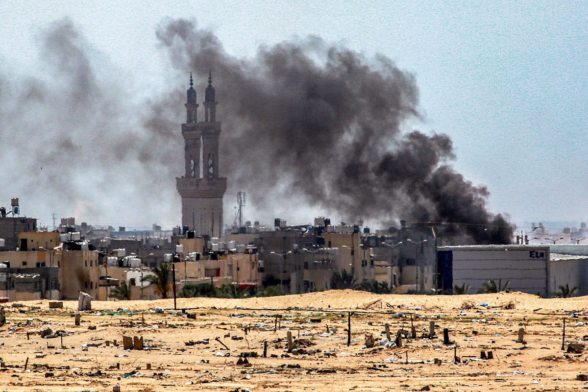 <i>Bashar Taleb/AFP/Getty Images via CNN Newsource</i><br/>This picture taken from Khan Yunis in the southern Gaza Strip shows smoke plumes billowing during ongoing battles in the Sultan neighbourhood in the northwest of Rafah on June 18