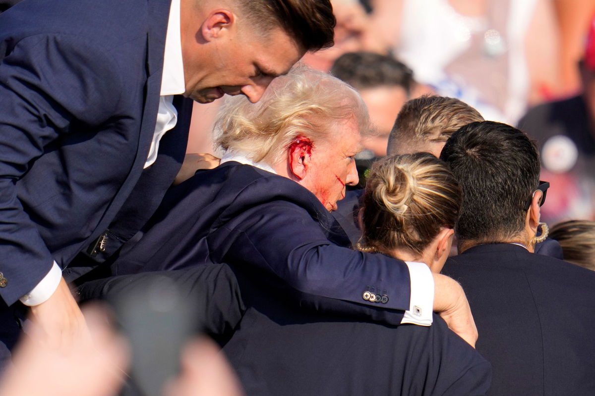 The Secret Service said in a statement that former president Donald Trump is “safe” and that the incident is being investigated after Trump was rushed offstage with blood on his ear and face after a shooting during his Saturday evening rally in Butler, Pennsylvania.