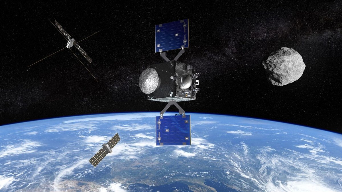An artist's impression depicts the newly announced European Space Agency's Rapid Apophis Mission for Space Safety, or Ramses, spacecraft. The spacecraft is seen alongside satellites and the asteroid Apophis, which will closely approach Earth in 2029.