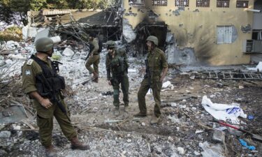 Photographs of some of those taken hostage by Hamas during the October 7 attack on Israel are seen in Tel Aviv