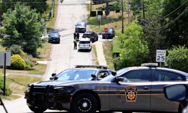 Police vehicles are seen around the house of Thomas Matthew Crooks in Bethel Park