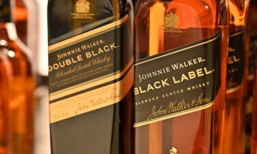 Bottles of Johnnie Walker Black Label and Double Black blended scotch whisky are displayed for sale in January in Leigh on Sea