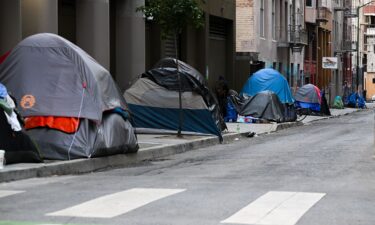 A homeless encampment is seen on a sidewalk in San Francisco