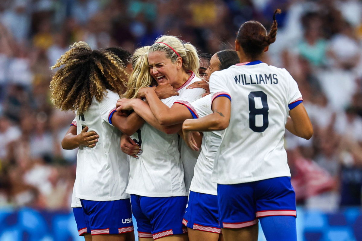 <i>Pascal Guyot/AFP/Getty Images via CNN Newsource</i><br/>US players celebrate Korbin Albert's goal against Australia.