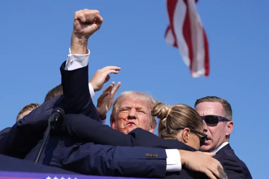 Trump escorted off stage