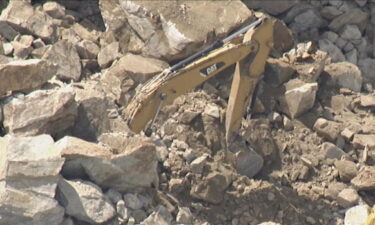 The rock wall collapsed on top of the excavator at the quarry in Sterling on Thursday