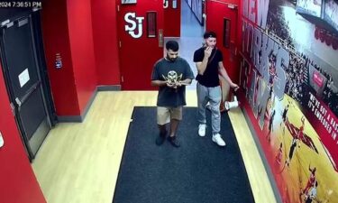 The NYPD says this surveillance shows the suspects holding a ceremonial sword and bullhorn burglarized from St. John University Coach Rick Pitino's office.