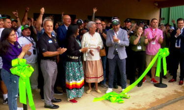 A ribbon-cutting ceremony is held outside the Great Smoky Cannabis Dispensary in Cherokee