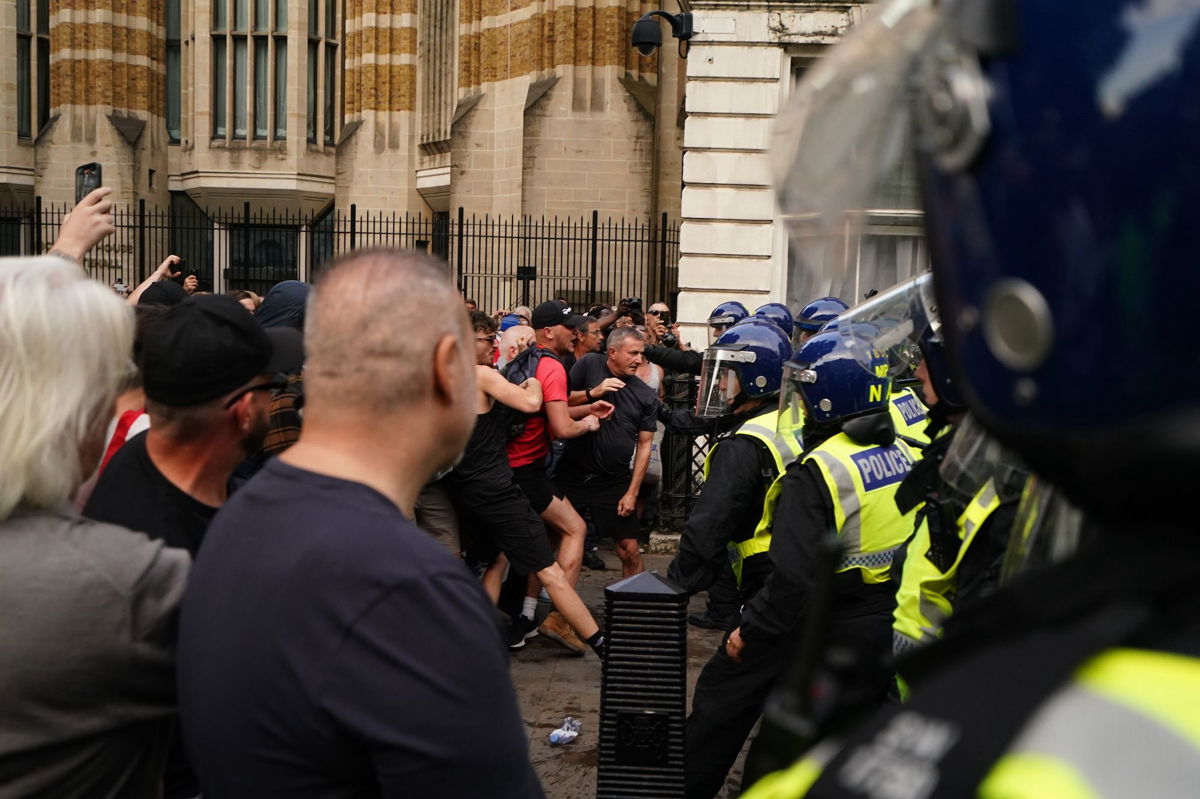 <i>Jordan Pettitt/PA Images/Getty Images via CNN Newsource</i><br/>Far-right protesters scuffle with police at the 