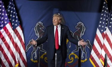 Former President Donald Trump arrives to speak at a campaign rally in Harrisburg