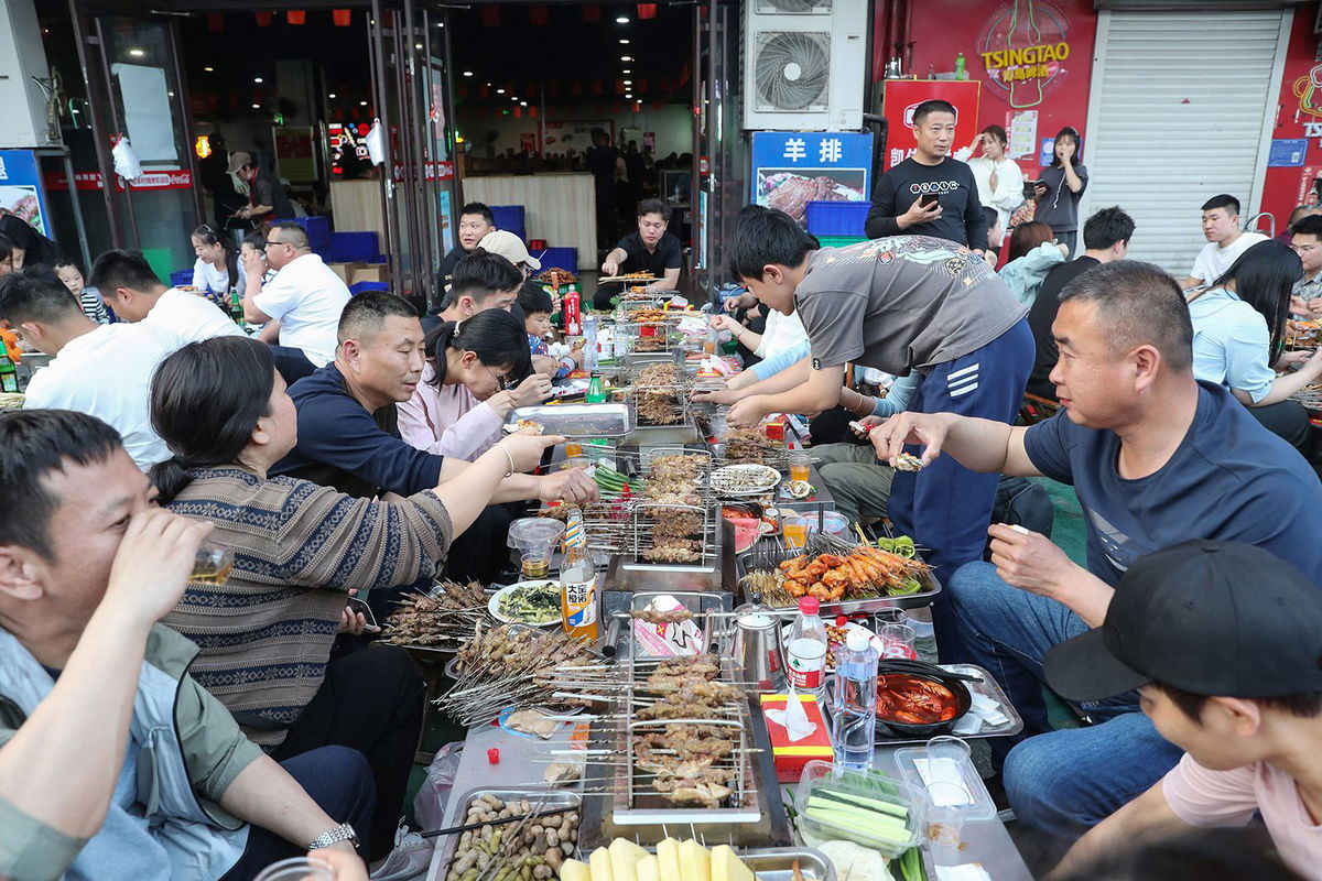 <i>Jiumei Danzeng/China News Service/VCG/Getty Images via CNN Newsource</i><br/>A staff member cooks Tianshui Spicy Hot Pot on March 14