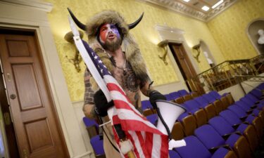 Jacob Chansley inside the Senate Chamber on January 06