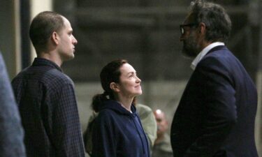 Evan Gershkovich and Alsu Kurmasheva speak with Special Presidential Envoy for Hostage Affairs Roger Carstens at Kelly Field in San Antonio