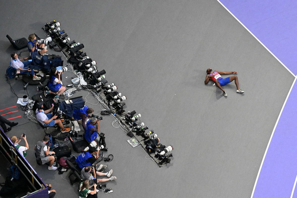 <i>Antonin Thuillier/AFP/Getty Images via CNN Newsource</i><br/>Noah Lyles collapsed after coming in third in the men's 200 meters on August 8.