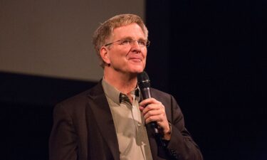 Travel author and host Rick Steves speaks on stage in Austin