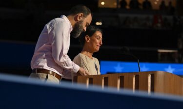 People watch Oprah Winfrey speak at the 2024 Democratic National Convention in Chicago on August 21.