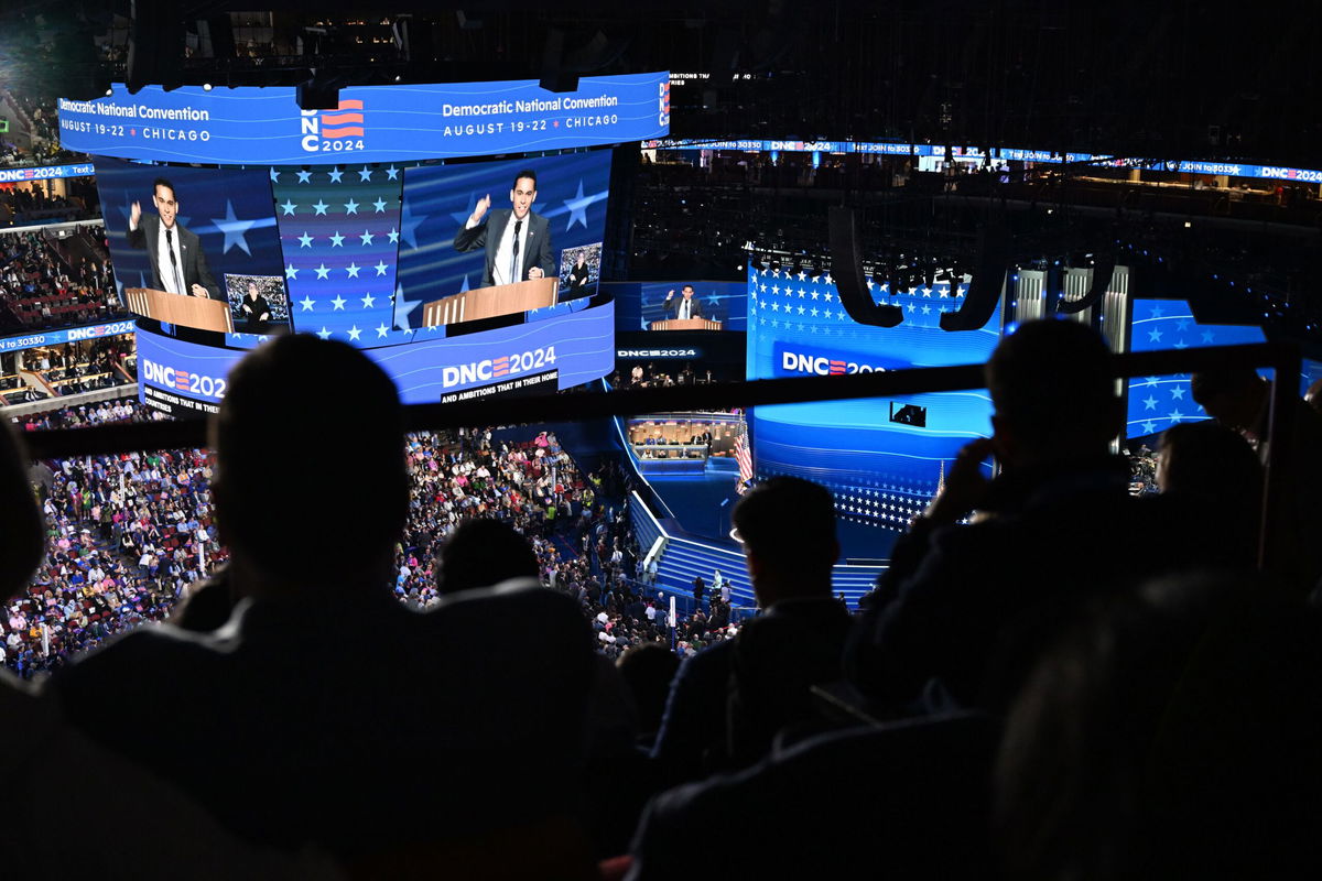 <i>Austin Steele/CNN via CNN Newsource</i><br/>Content creator Carlos Eduardo Espina speaks at the United Center during the Democratic National Convention in Chicago on Wednesday