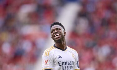 Vinicius Junior of Real Madrid CF smiles during the LaLiga EA Sports match between CA Osasuna and Real Madrid CF at Estadio El Sadar on March 16