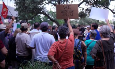 Supporters attend a news conference where officials with the League of United Latin American Citizens