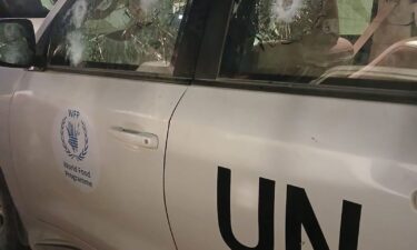 A photo released by the World Food Program shows multiple bullet marks in the driver's side window; in total