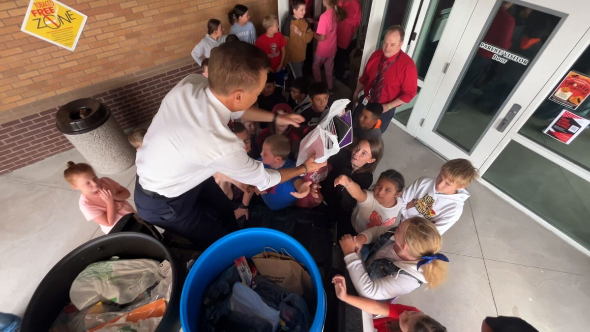 Todd Kunz hands out school supplies to students at Henry's Fork Elementary in St. Anthony on Sept. 11, 2024.  They were donated by fairgoers to the Eastern Idaho State Fair.