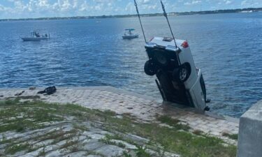 Bystanders helped rescue the driver of a truck that crashed into a body of water over the weekend