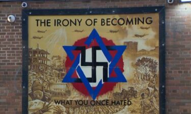 The mural that replaced the mural of Breonna Taylor sitting at Holton and Locust streets shows the Star of David intertwined with a swastika alongside the message