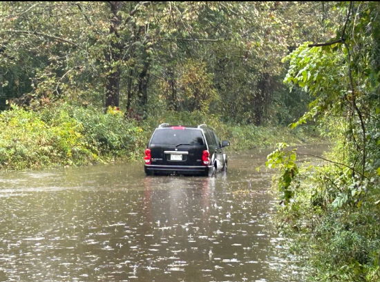 <i>WLOS via CNN Newsource</i><br/>An SUV stranded by floodwaters in Transylvania County