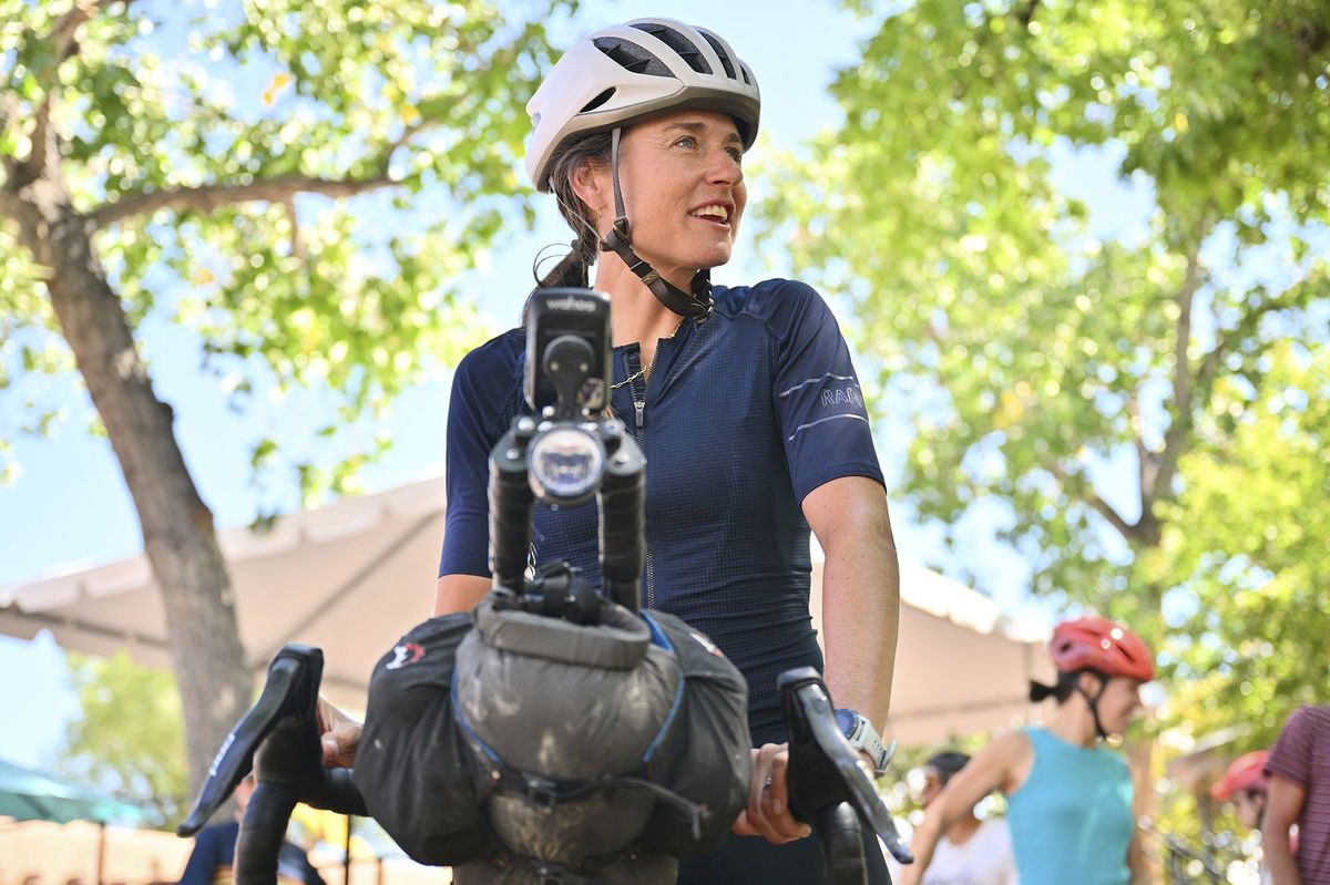 <i>Sam Wasson/Sipa USA/AP via CNN Newsource</i><br/>Lael Wilcox prepares to resume riding after taking a break in the Santa Fe Plaza on September 4.