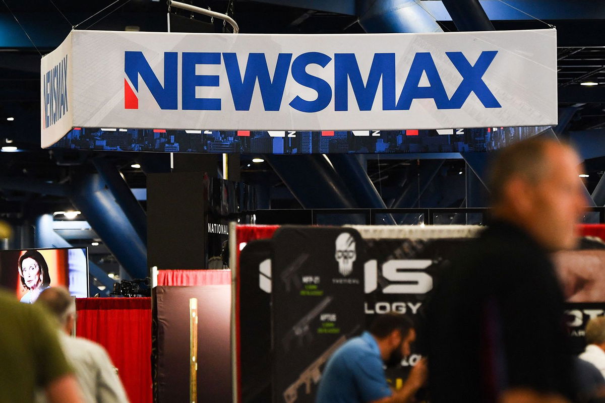 <i>Callaghan O'Hare/Reuters via CNN Newsource</i><br/>A Newsmax booth broadcasts at the National Rifle Association annual convention in Houston on May 29