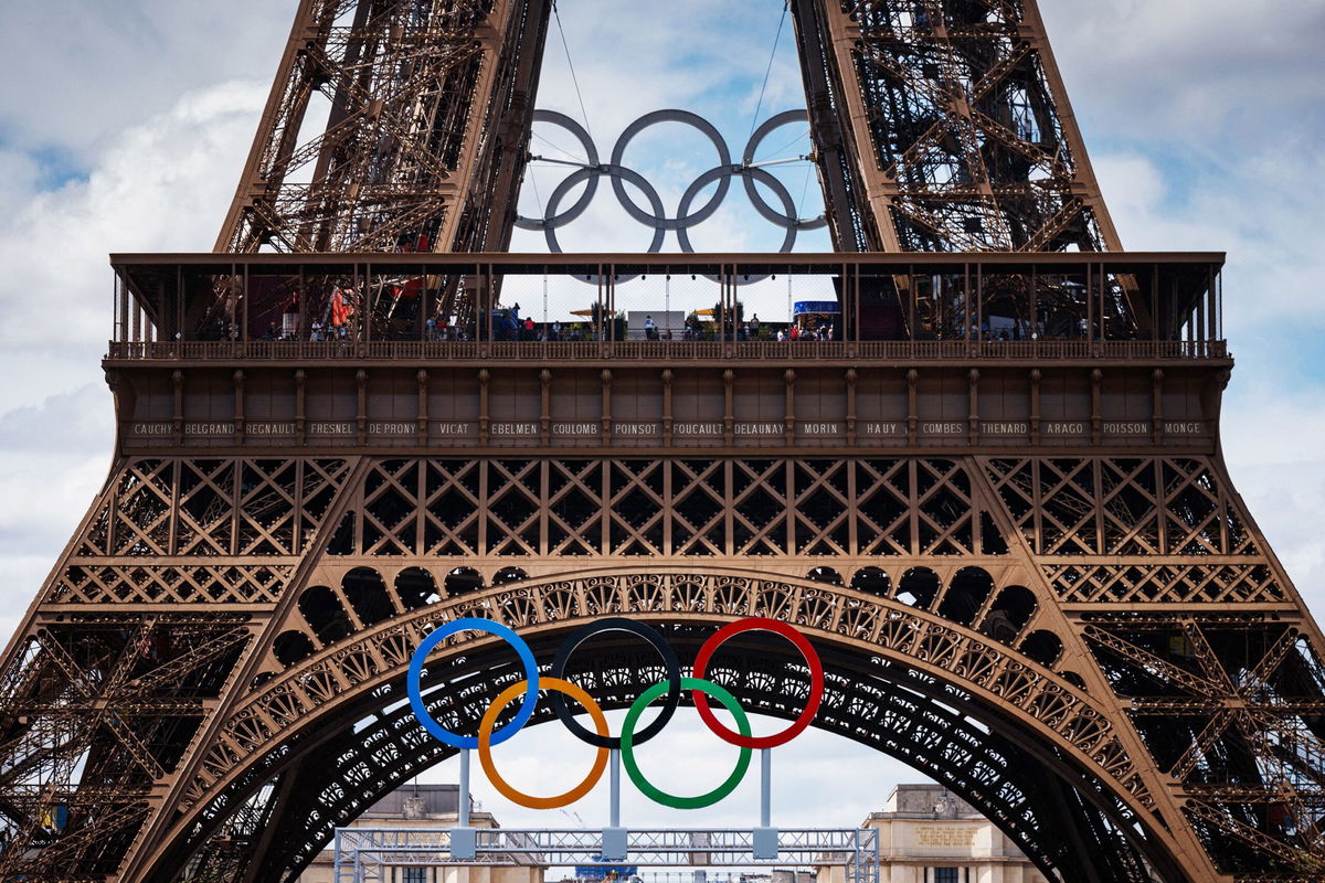 <i>Tingshu Wang/Reuters via CNN Newsource</i><br/>Medallists parade in front of the Eiffel Tower during the Games.