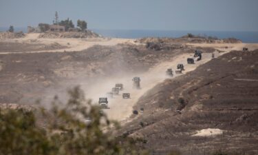 An Israeli army convoy moves along the border with the Gaza Strip in southern Israel on August 21