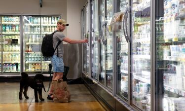 A customer shops for dairy products at a supermarket in Manhattan on July 11 in New York City.