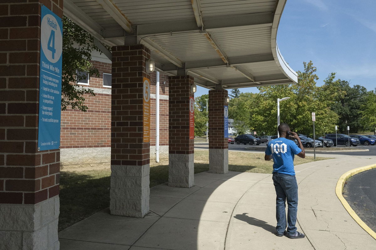 <i>Roberto Schmidt/AFP/Getty Images via CNN Newsource</i><br/>A Haitian father tried to pick his son up from Fulton Elementary School