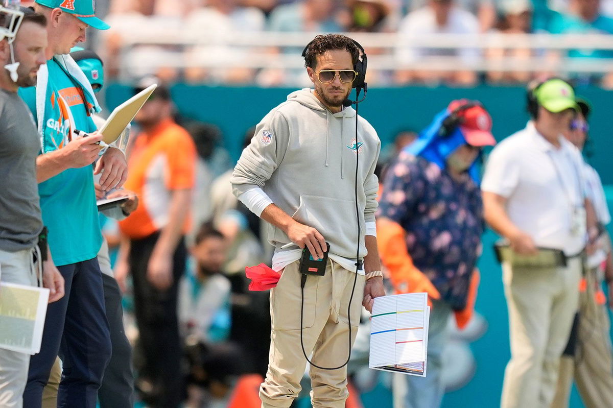 <i>Megan Briggs/Getty Images via CNN Newsource</i><br/>Miami Dolphins head coach Mike McDaniel embraces Tua Tagovailoa as he leaves the field after suffering a concussion against the Buffalo Bills.