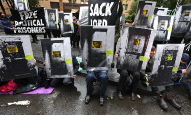 Supporters of Phoebe Plummer and Anna Holland from Just Stop Oil protest in front of Southwark Crown Court on September 27