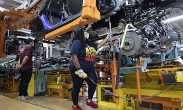 A 2021 Jeep Grand Cherokee L is assembled at the Stellantis Detroit Assembly Complex-Mack in June 2021 in Detroit.